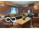 Well-lit kitchen featuring stainless steel appliances and center island at 11555 Ross Common Dr, Indianapolis, IN 46229