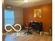 Home office with hardwood floors, a window, and a desk at 11555 Ross Common Dr, Indianapolis, IN 46229