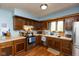 Updated kitchen featuring wood cabinets, stainless appliances, and ample counter space at 1186 Castle Dr, Franklin, IN 46131