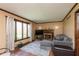 Bright living room features large windows and a charming fireplace at 1186 Castle Dr, Franklin, IN 46131