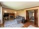 Comfortable living room showcases a fireplace and access to dining area at 1186 Castle Dr, Franklin, IN 46131
