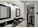 Bathroom features a double sink vanity, modern fixtures and a walk-in closet at 12005 Hardwick Dr, Fishers, IN 46038