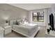 Bright bedroom boasts a statement wall and large window at 12005 Hardwick Dr, Fishers, IN 46038