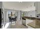 Eat-in kitchen features a modern chandelier and a view to the outdoors at 12005 Hardwick Dr, Fishers, IN 46038