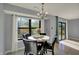 Dining area with modern chandelier and view to the outdoors at 12005 Hardwick Dr, Fishers, IN 46038