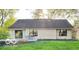Back exterior of home featuring a backyard and concrete patio at 12005 Hardwick Dr, Fishers, IN 46038