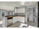 Bright kitchen features white cabinetry, stainless appliances and breakfast bar at 12005 Hardwick Dr, Fishers, IN 46038