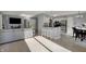 Open concept living space showcasing a living room, dining area, wood floors and stainless steel appliances at 12005 Hardwick Dr, Fishers, IN 46038