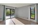 Bright living room with a sliding glass door leading to the patio area and a large window at 12005 Hardwick Dr, Fishers, IN 46038