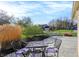 This outdoor patio features beautiful landscaping and a perfect spot for enjoying the outdoors at 12005 Hardwick Dr, Fishers, IN 46038
