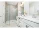 Modern bathroom with double vanity, glass-enclosed shower, and stylish fixtures at 1319 English Ave, Indianapolis, IN 46203