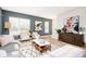Bright and airy living room featuring comfortable seating, modern decor, and large windows at 1319 English Ave, Indianapolis, IN 46203