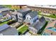 Aerial view of property features a well-kept lawn, patio, and a modern exterior near a school at 1317 Spann Ave, Indianapolis, IN 46203
