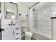 Well-lit bathroom with white subway tile, modern fixtures, and a shower-tub combination at 1317 Spann Ave, Indianapolis, IN 46203