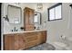Modern bathroom featuring double vanity, wood cabinets, quartz countertop and patterned tile floor at 1317 Spann Ave, Indianapolis, IN 46203