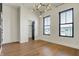 Bright bedroom with hardwood floors, modern lighting, large windows, and walk-in closet at 1317 Spann Ave, Indianapolis, IN 46203
