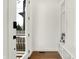 Bright entryway featuring wood floors, a modern bench, and a view of the outdoors at 1317 Spann Ave, Indianapolis, IN 46203