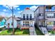 Charming white two-story home featuring a welcoming porch and landscaped front yard at 1317 Spann Ave, Indianapolis, IN 46203