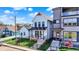 Charming white two-story home featuring a welcoming porch and landscaped front yard at 1317 Spann Ave, Indianapolis, IN 46203