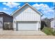 Exterior of the garage with a modern white door and siding, complementing the surrounding landscape at 1317 Spann Ave, Indianapolis, IN 46203