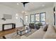 Bright and airy living room featuring hardwood floors, modern lighting, and stylish contemporary furnishings at 1317 Spann Ave, Indianapolis, IN 46203