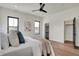 Bright main bedroom with hardwood floors, white walls, closet, and lots of natural light at 1317 Spann Ave, Indianapolis, IN 46203