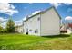 Spacious backyard with lush lawn surrounding a vinyl-sided two-story home, perfect for outdoor activities and relaxation at 13331 Grouse Point Trl, Carmel, IN 46033