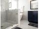 Bright bathroom featuring a glass-enclosed shower and free-standing soaking tub at 13331 Grouse Point Trl, Carmel, IN 46033
