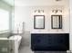 Modern bathroom with a double vanity, soaking tub, and separate glass shower at 13331 Grouse Point Trl, Carmel, IN 46033