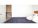 View of the bedroom with a staircase to the right side of the space at 13331 Grouse Point Trl, Carmel, IN 46033