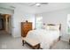 Bright bedroom with hardwood furniture, soft carpet, and ample natural light at 13331 Grouse Point Trl, Carmel, IN 46033