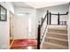 Bright entryway with a staircase and red rug at 13331 Grouse Point Trl, Carmel, IN 46033