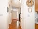 Inviting foyer featuring hardwood floors, a grand staircase, and ample natural light at 13331 Grouse Point Trl, Carmel, IN 46033
