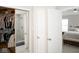 Hallway showing a walk-in closet and doorway to the bedroom at 13331 Grouse Point Trl, Carmel, IN 46033