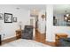 Open hallway showcasing the home's neutral color palette, hardwood floors, and an inviting entryway at 13331 Grouse Point Trl, Carmel, IN 46033