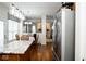 Open-concept kitchen featuring a kitchen island with stainless steel appliances at 13331 Grouse Point Trl, Carmel, IN 46033
