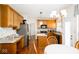 Spacious kitchen with stainless steel appliances, light wood cabinets, granite counters, and an adjacent dining area at 13331 Grouse Point Trl, Carmel, IN 46033