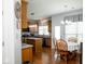Open kitchen and dining area offering stainless steel appliances, wood cabinets, and a seamless flow for entertaining at 13331 Grouse Point Trl, Carmel, IN 46033