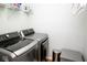 Laundry room featuring modern LG washer and dryer units and white shelving at 13331 Grouse Point Trl, Carmel, IN 46033