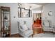 Inviting foyer with hardwood floors, view to the staircase and a home office at 13331 Grouse Point Trl, Carmel, IN 46033