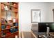 Bright office featuring wood bookshelves, a large desk, and elegant decor at 13331 Grouse Point Trl, Carmel, IN 46033
