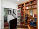 Well-appointed home office with custom built-in shelving, french doors, and a professional atmosphere for productivity at 13331 Grouse Point Trl, Carmel, IN 46033