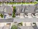 Townhomes from an aerial view featuring fenced patios, driveways, and manicured green spaces at 1352 Middlebury Dr, Westfield, IN 46074