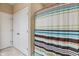 Bathroom featuring a colorful shower curtain, neutral tile flooring, and clean white doors, for a stylish design at 1352 Middlebury Dr, Westfield, IN 46074