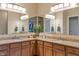 Bathroom featuring double sinks, granite countertops, wood cabinetry, and ample lighting for a functional space at 1352 Middlebury Dr, Westfield, IN 46074