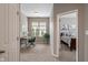 This bedroom features a desk, an office chair and a glimpse into the main bedroom at 1352 Middlebury Dr, Westfield, IN 46074