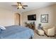 The bedroom has neutral walls, a ceiling fan and decor accents at 1352 Middlebury Dr, Westfield, IN 46074