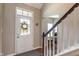 Welcoming entryway featuring a white front door with decorative wreath and staircase at 1352 Middlebury Dr, Westfield, IN 46074