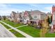 Beautiful townhomes feature brick and siding, a front porch and mature landscaping at 1352 Middlebury Dr, Westfield, IN 46074