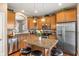 Beautiful kitchen featuring granite counters, island with bar stools, and stainless appliances at 1352 Middlebury Dr, Westfield, IN 46074
